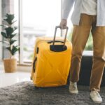 Single traveller tourism man walking carry a luggage begin a jou