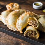 Traditional baked Argentine empanadas savoury pastries with meat